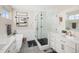 Spa-like bathroom with soaking tub, glass shower, and double vanity with stone countertops at 2705 Fox View Trl, Franktown, CO 80116