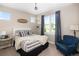Cozy bedroom with a comfortable bed, a plush chair, and views to the neighborhood outside at 2705 Fox View Trl, Franktown, CO 80116