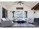 Covered patio with high ceiling and comfortable furniture and a view of the open sky at 2705 Fox View Trl, Franktown, CO 80116