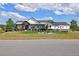 Beautiful two-story home with a green lawn, lovely landscaping, and a charming covered entryway at 2705 Fox View Trl, Franktown, CO 80116