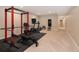Home gym featuring weight rack, treadmill, and fitness equipment at 2705 Fox View Trl, Franktown, CO 80116