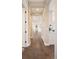 Long hallway features wood floors and ample space connecting rooms at 2705 Fox View Trl, Franktown, CO 80116