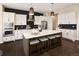Spacious kitchen offers a large center island with seating and plenty of storage at 2705 Fox View Trl, Franktown, CO 80116