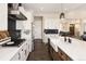 Bright, open kitchen design with stainless appliances, modern finishes and center island at 2705 Fox View Trl, Franktown, CO 80116