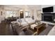Inviting living room featuring a cozy fireplace and comfortable seating arrangement at 2705 Fox View Trl, Franktown, CO 80116