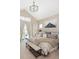 Vaulted ceiling primary bedroom with access to private outdoor patio seating area at 2705 Fox View Trl, Franktown, CO 80116