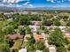 Aerial view of the property, showing the neighborhood's mature trees and proximity to parks and amenities at 4604 Routt St, Wheat Ridge, CO 80033
