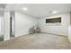 Carpeted basement space with a window, ready for customization at 4604 Routt St, Wheat Ridge, CO 80033