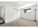 Carpeted bedroom with closet space and natural light at 4604 Routt St, Wheat Ridge, CO 80033