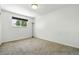 Bright bedroom with a window and neutral carpet flooring at 4604 Routt St, Wheat Ridge, CO 80033
