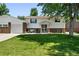 Charming two-story home with a well-maintained front yard and brick accents at 4604 Routt St, Wheat Ridge, CO 80033
