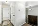 Bright hallway featuring wood floors, white trim, and stairway to the upper level at 4604 Routt St, Wheat Ridge, CO 80033