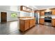 Open-concept kitchen with stainless steel appliances and access to a bright living space at 4604 Routt St, Wheat Ridge, CO 80033