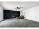 Cozy living room with carpet, featuring a stone fireplace and neutral tones at 4604 Routt St, Wheat Ridge, CO 80033