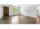 Bright living room featuring hardwood floors, large window, and fresh white paint at 4604 Routt St, Wheat Ridge, CO 80033