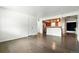 Open living area with hardwood floors flowing into the adjacent kitchen space at 4604 Routt St, Wheat Ridge, CO 80033