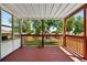 Covered porch with views of the backyard, perfect for relaxing and entertaining at 4604 Routt St, Wheat Ridge, CO 80033