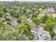An aerial view of a quiet neighborhood street, showcasing the mature trees and well-maintained houses at 3218 S Lafayette St, Englewood, CO 80113