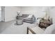 Finished basement with seating area and neutral carpet flooring at 3218 S Lafayette St, Englewood, CO 80113
