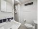 Well-lit bathroom with modern fixtures, vanity with storage, and a clean, functional design at 3218 S Lafayette St, Englewood, CO 80113