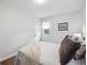 Bright bedroom with a comfortable bed, neutral tones, and a large window at 3218 S Lafayette St, Englewood, CO 80113