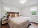 Primary bedroom with modern decor, hardwood floors, and natural lighting at 3218 S Lafayette St, Englewood, CO 80113
