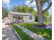 Inviting front yard with a well-maintained lawn and a beautiful shade tree at 3218 S Lafayette St, Englewood, CO 80113