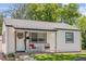 Charming exterior view of home featuring a cozy porch with decorative accents at 3218 S Lafayette St, Englewood, CO 80113
