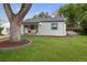 Charming single-story home with a well-maintained lawn and a beautiful tree in the front yard at 3218 S Lafayette St, Englewood, CO 80113