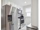 Bright kitchen features stainless steel refrigerator, microwave, and electric range oven at 3218 S Lafayette St, Englewood, CO 80113