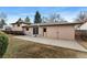 Concrete patio in large backyard and exterior door on well-maintained neutral-colored home at 2078 S Quintero St, Aurora, CO 80013