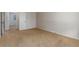 Bedroom with neutral walls, beige carpet, and view of two doorways at 7318 W Cedar Cir, Lakewood, CO 80226