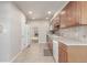 Classic kitchen featuring wooden cabinets, tile backsplash, and stainless steel appliances at 7318 W Cedar Cir, Lakewood, CO 80226