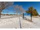 Winter scene of O'Kane Park with snow-covered ground and signage, Lakewood community at 7318 W Cedar Cir, Lakewood, CO 80226