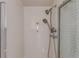 Shower includes glass door and dual shower heads at 7318 W Cedar Cir, Lakewood, CO 80226