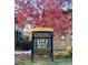 Mansion Park community sign amidst lush landscaping, offering guest parking spots at 7777 E 23Rd Ave # 201, Denver, CO 80238