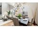 Stylish dining area open to the living room and kitchen, filled with natural light at 7777 E 23Rd Ave # 201, Denver, CO 80238