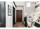 Welcoming entryway featuring high ceilings, modern decor, and access to a spacious living area at 7777 E 23Rd Ave # 201, Denver, CO 80238