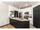 Modern kitchen with stainless steel appliances, stone countertops, and a center island at 7777 E 23Rd Ave # 201, Denver, CO 80238