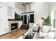 Bright living room features a cozy fireplace, high ceilings, and natural light at 7777 E 23Rd Ave # 201, Denver, CO 80238