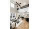 Spacious living room with high ceilings and modern design, seamlessly connecting to dining and kitchen at 7777 E 23Rd Ave # 201, Denver, CO 80238