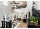 Bright, open living room with high ceilings, modern decor, and seamless flow to dining and kitchen at 7777 E 23Rd Ave # 201, Denver, CO 80238