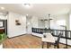 Open loft space with modern railing, wood floors, and ample natural light at 7777 E 23Rd Ave # 201, Denver, CO 80238