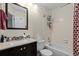 Charming bathroom with tub and shower combination, vanity and decorative accents at 10886 Bayfield Way, Parker, CO 80138