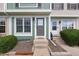 Charming front exterior featuring a gray front door and landscaped entrance at 10886 Bayfield Way, Parker, CO 80138