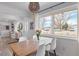 Dining space with modern table set and large window offering natural light at 290 Pierce St, Lakewood, CO 80226