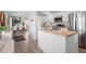 Modern kitchen with white cabinets, stainless steel appliances, and an island at 290 Pierce St, Lakewood, CO 80226