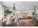 Open-concept living and dining area with hardwood floors and bright natural light at 290 Pierce St, Lakewood, CO 80226