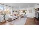 Inviting living room featuring a comfortable sofa, stylish decor, and natural light at 290 Pierce St, Lakewood, CO 80226