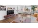 Bright living room featuring modern furnishings, hardwood floors, and a decorative rug at 290 Pierce St, Lakewood, CO 80226